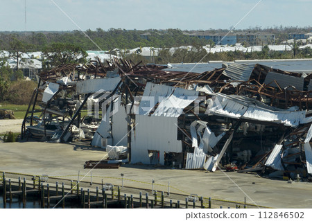 Boat station destroyed by hurricane wind in Florida coastal area. Consequences of natural disaster Boat station destroyed by hurricane wind in Florida coastal area. Consequences of natural disaster 112846502