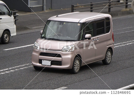 Light passenger car (tall wagon) on the road 112846691