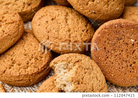 Fresh oatmeal cookies close-up. The concept of healthy eating. Fresh oatmeal cookies close-up. The concept of healthy eating. 112847415
