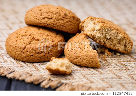 Fresh oatmeal cookies close-up. The concept of healthy eating. Fresh oatmeal cookies close-up. The concept of healthy eating. 112847432