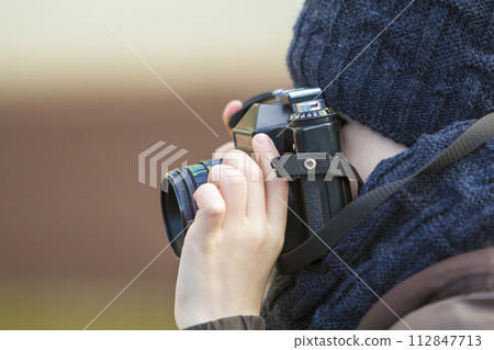 Portrait of little boy with vintage photo camera Portrait of little boy with vintage photo camera 112847713