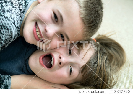 Two children boy and girl fooling around having fun together. Happy childhood concept. 112847790