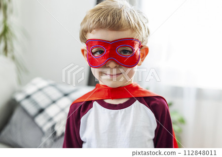 Boy in Superhero Costume Smiling 112848011