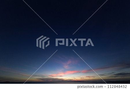 Mysterious dusk sky with red cirrus clouds, late summer, ultra-wide angle, sky-based, 230915pm 112848432