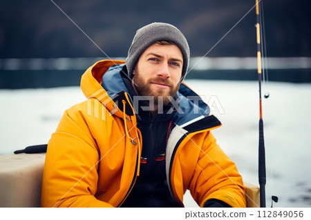 AI-generated content. Brutal fisherman ice fishing on a frozen lake in winter 112849056