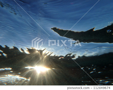 Sun light underwater 112849674