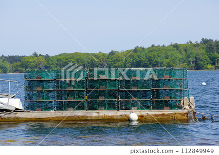 Lobster traps at a fishing pier in coastal Maine, New England Lobster traps at a fishing pier in coastal Maine, New England 112849949