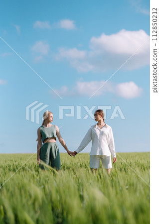 Two Beautiful woman in the green field. Nature, vacation, relax and lifestyle. Summer landscape. Two Beautiful woman in the green field. Nature, vacation, relax and lifestyle. Summer landscape. 112850212