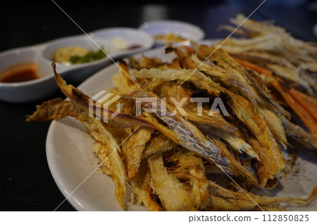 Crispy and savory dried pollack 112850825