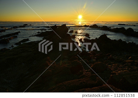 Sunrise over the misty Pacific Ocean over the Cretaceous reefs of Hiraiso Coast 112851538