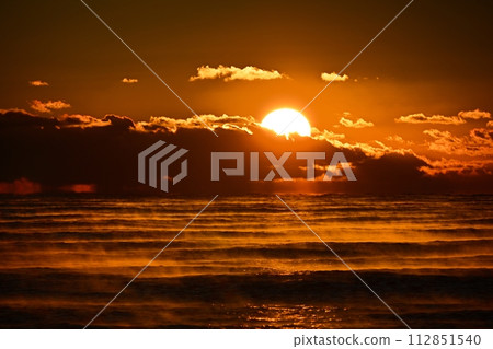 Sunrise over the foggy waters of the Pacific Ocean at Hiraiso Coast 112851540