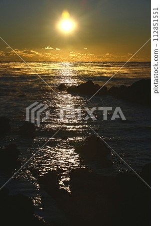 Sunrise over the misty Pacific Ocean over the Cretaceous reefs of Hiraiso Coast Sunrise over the misty Pacific Ocean over the Cretaceous reefs of Hiraiso Coast 112851551