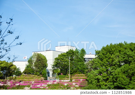 Okazaki City General Learning Center seen from Okuyamada Pond where azaleas bloom Okazaki City General Learning Center seen from Okuyamada Pond where azaleas bloom 112851986
