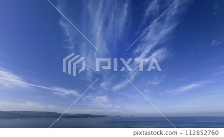 Southern sky and sea in the morning with cirrus clouds spreading radially, ultra wide angle, mainly sky, 230707am Southern sky and sea in the morning with cirrus clouds spreading radially, ultra wide angle, mainly sky, 230707am 112852760