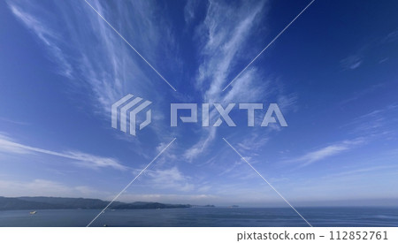 Southern sky and sea in the morning with cirrus clouds spreading radially, ultra wide angle, mainly sky, 230707am Southern sky and sea in the morning with cirrus clouds spreading radially, ultra wide angle, mainly sky, 230707am 112852761