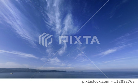 Southern sky and sea in the morning with cirrus clouds spreading radially, ultra wide angle, mainly sky, 230707am Southern sky and sea in the morning with cirrus clouds spreading radially, ultra wide angle, mainly sky, 230707am 112852762