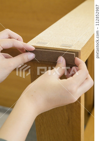 Preventing scratches from furniture legs (before and after) 112852987