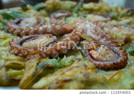 Korean-style pancakes with whole octopus and green onion Korean-style pancakes with whole octopus and green onion 112854001