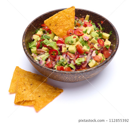 traditional salsa dip snack in wooden bowl and corn nacho chips isolated 112855392