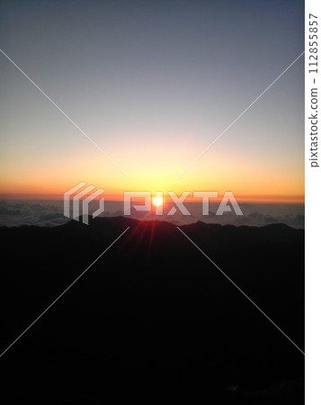 Sunshine coming from a sea of clouds at Mt. Fuji Sunshine coming from a sea of clouds at Mt. Fuji 112855857