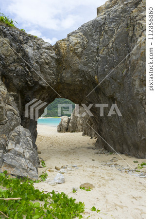 Natural stone arch of Aharen beach in Tokashiki Island, Okinawa, Japan. Natural stone arch of Aharen beach in Tokashiki Island, Okinawa, Japan. 112856860