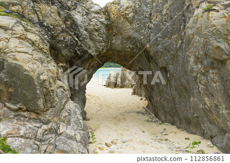 Natural stone arch of Aharen beach in Tokashiki Island, Okinawa, Japan. Natural stone arch of Aharen beach in Tokashiki Island, Okinawa, Japan. 112856861