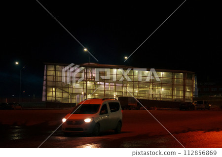 Windows glowing in the darkness of the night, showcasing a city urban landscape and architectural design. Windows glowing in the darkness of the night, showcasing a city urban landscape and architectural design. 112856869