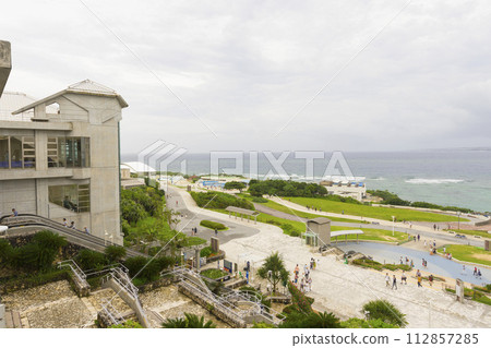 Okinawa Churaumi Aquarium with ocean in the background in Okinawa, Japan Okinawa Churaumi Aquarium with ocean in the background in Okinawa, Japan 112857285