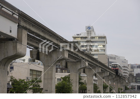 Okinawa, Japan - June 8,2019 : Yui Rail or Okinawa Urban Monorail running on track at twilight in Okinawa, Japan on June 8,2019 Okinawa, Japan - June 8,2019 : Yui Rail or Okinawa Urban Monorail running on track at twilight in Okinawa, Japan on June 8,2019 112857342
