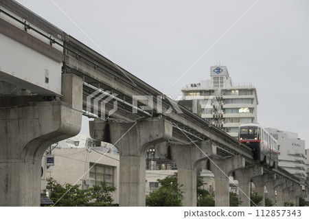 Okinawa, Japan - June 8,2019 : Yui Rail or Okinawa Urban Monorail running on track at twilight in Okinawa, Japan on June 8,2019 112857343