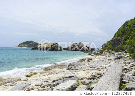 Big rock at Aharen Beach on Tokashiki Island in Okinawa, Japan. Big rock at Aharen Beach on Tokashiki Island in Okinawa, Japan. 112857498