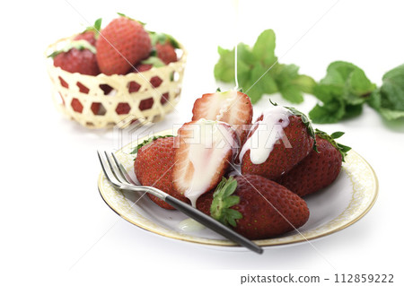 Fresh and delicious strawberry marihime with condensed milk Fresh and delicious strawberry marihime with condensed milk 112859222