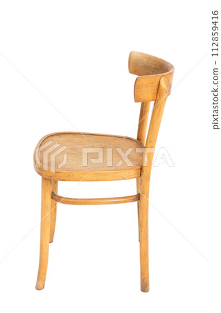 Polish wooden original chair from the 70's and 80's. Side view. Polish wooden original chair from the 70's and 80's. Side view. 112859416