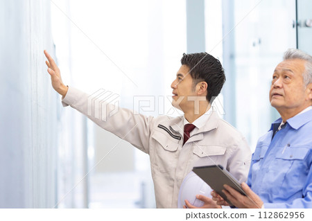 Man in work clothes Real estate developer Man in work clothes Real estate developer 112862956