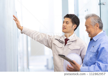 Man in work clothes Real estate developer Man in work clothes Real estate developer 112862957