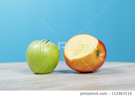 Apples of different varieties are lying on the table. Apples of different varieties are lying on the table. 112863518