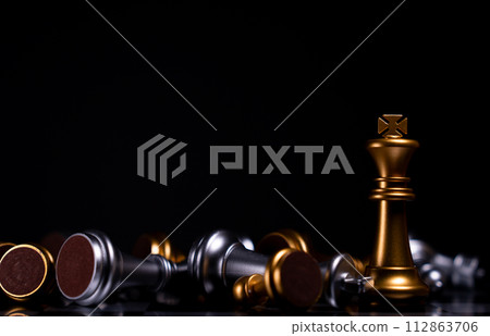 Golden King chess is last standing in the chess board, Concept of successful business leadership Golden King chess is last standing in the chess board, Concept of successful business leadership 112863706