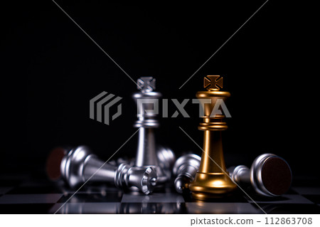 Golden and Silver King chess is last standing in the chess board, Concept of successful business leadership, Confrontation and loss Golden and Silver King chess is last standing in the chess board, Concept of successful business leadership, Confrontation and loss 112863708
