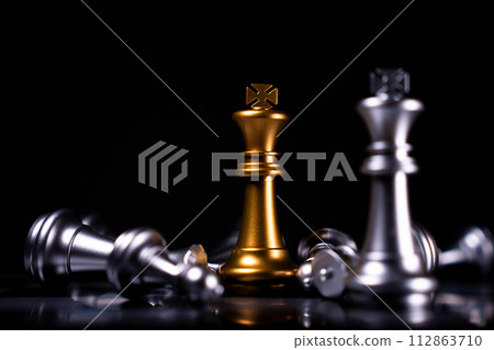 Golden and Silver King chess is last standing in the chess board, Concept of successful business leadership, Confrontation and loss Golden and Silver King chess is last standing in the chess board, Concept of successful business leadership, Confrontation and loss 112863710