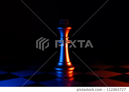 Golden Chess King standing alone on the chessboard Golden Chess King standing alone on the chessboard 112863727