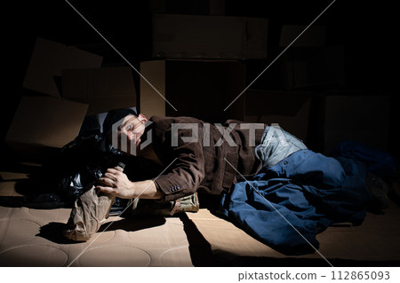 A middle-aged homeless man became alcoholic because of his situation. A middle-aged homeless man became alcoholic because of his situation. 112865093