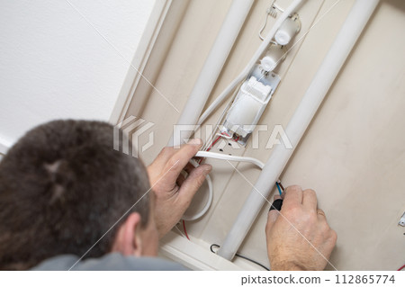 The profession of electrician is one of the most demanding and responsible professions of a construction worker. 112865774