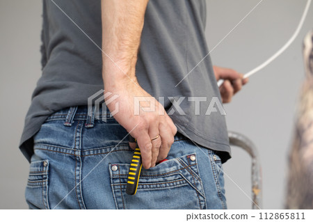 The profession of electrician is one of the most demanding and responsible professions of a construction worker. 112865811