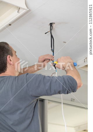 The profession of electrician is one of the most demanding and responsible professions of a construction worker. 112865921