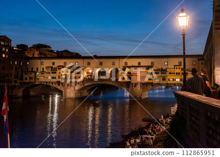 Famous Ponte Vecchio in Florence illuminated at night Famous Ponte Vecchio in Florence illuminated at night 112865951