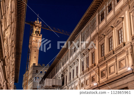 The famous Uffizi and the tower of the Palazzo Vecchio of Florence illuminated at night The famous Uffizi and the tower of the Palazzo Vecchio of Florence illuminated at night 112865961