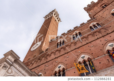 The iconic Palazzo Pubblico at the Piazza del Campo in downtown Siena The iconic Palazzo Pubblico at the Piazza del Campo in downtown Siena 112866281