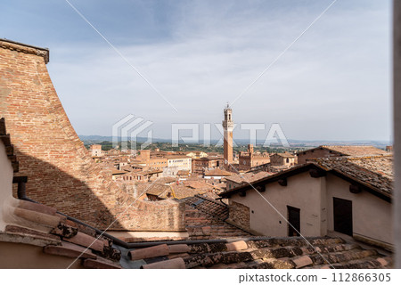 View over the roofs of Siena towards the Torre Magna, seen from the roof of the Siena cathedral 112866305