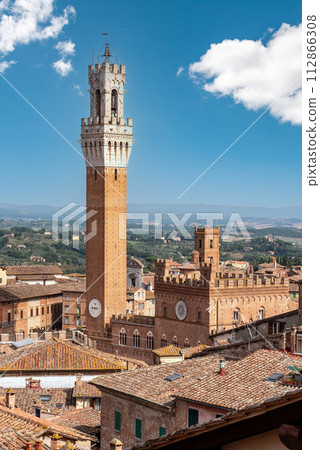 View over the roofs of Siena towards the Torre Magna, seen from the roof of the Siena cathedral 112866308