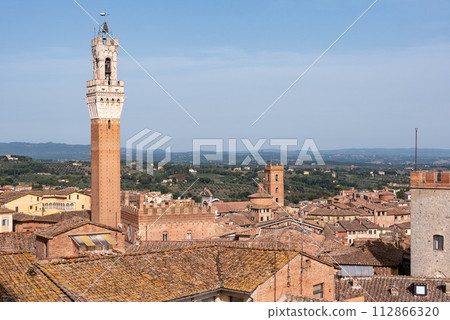 View over the roofs of Siena towards the Torre Magna, seen from the roof of the Siena cathedral View over the roofs of Siena towards the Torre Magna, seen from the roof of the Siena cathedral 112866320